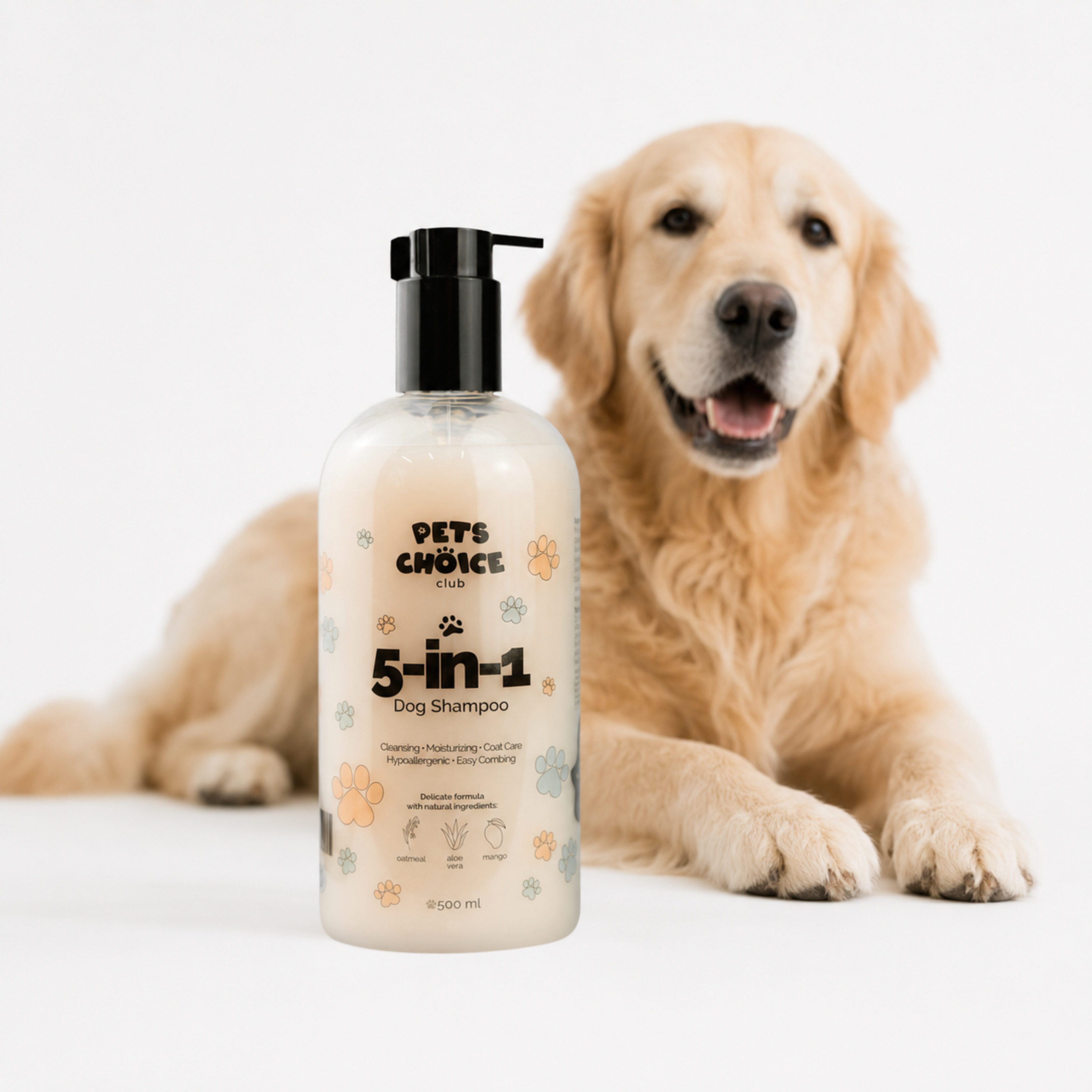 A bottle of Pets Choice 5-in-1 Dog Shampoo stands in front of a golden retriever dog lying down on a clean white background. The bottle is frosted to show the creamy off-white shampoo inside, with a black pump dispenser and colorful paw print illustrations on the label.