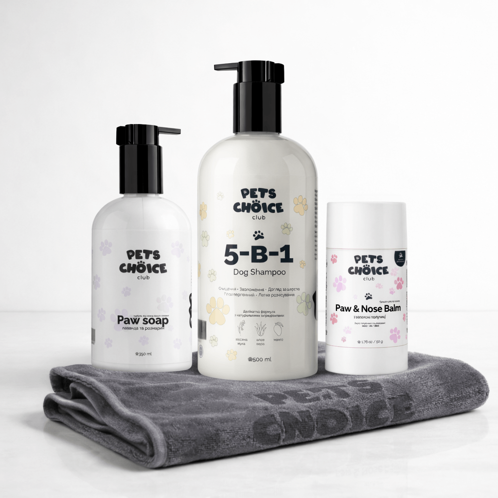 Pets Choice pet care products including paw soap, 5-B-1 shampoo, and paw & nose balm on a gray towel.