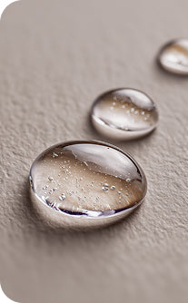 Close-up of water droplets on a textured surface