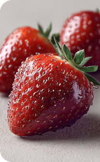 Close-up of fresh strawberries on a light gray background