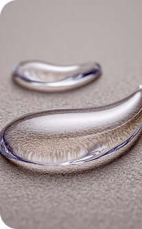 Close-up of a silver ring on a textured surface