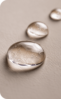 Close-up of water droplets on a textured surface