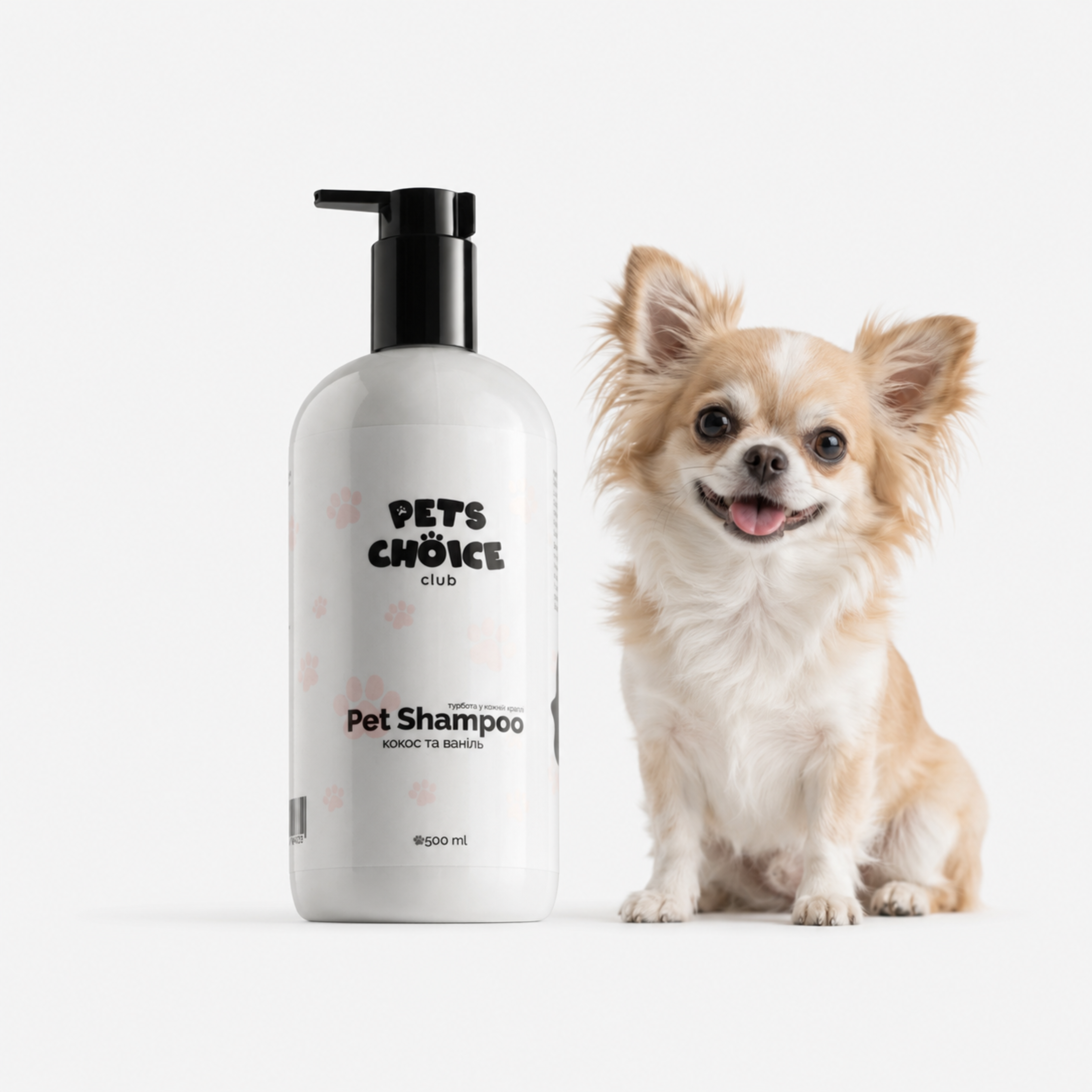 A bottle of Pets Choice Studio pet shampoo stands next to a small tan and white Chihuahua dog on a clean white background.