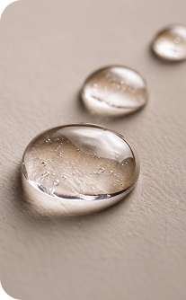 Close-up of water droplets on a textured surface